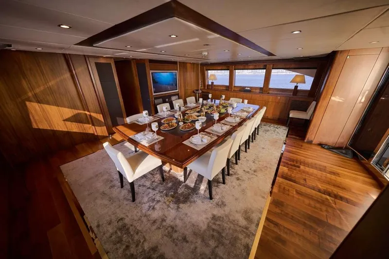  Yacht Photos Pics Luxurious dining area on a 2010 Sunseeker 131 Yacht, featuring elegant table settings.