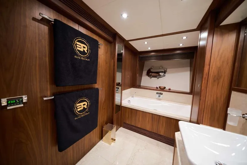 Yacht Photos Pics Luxurious bathroom on 2010 Sunseeker 131 Yacht with elegant wood paneling and modern fixtures.