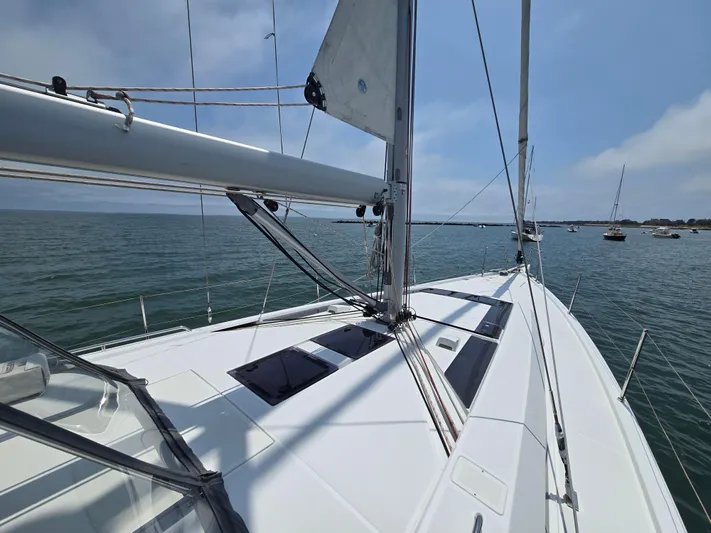 Off-piste Yacht Photos Pics 2019 Beneteau Oceanis 46.1 sailboat on calm sea, showcasing sleek deck design.
