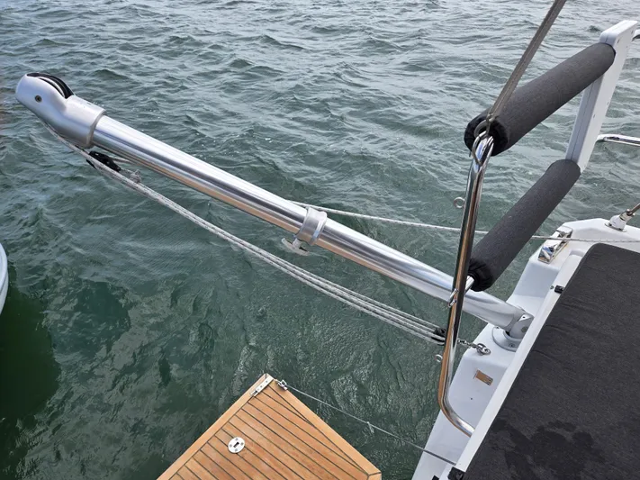 Off-piste Yacht Photos Pics Beneteau Oceanis 46.1 yacht detail, 2019 model, showing deck and railing over water.