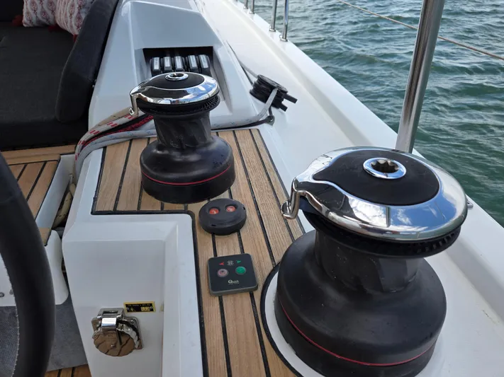 Off-piste Yacht Photos Pics Deck of 2019 Beneteau Oceanis 46.1 yacht with winches and control panel.