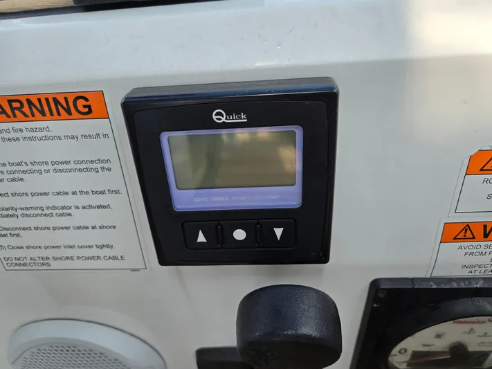 Off-piste Yacht Photos Pics Control panel on a 2019 Beneteau Oceanis 46.1 sailboat with warning labels.