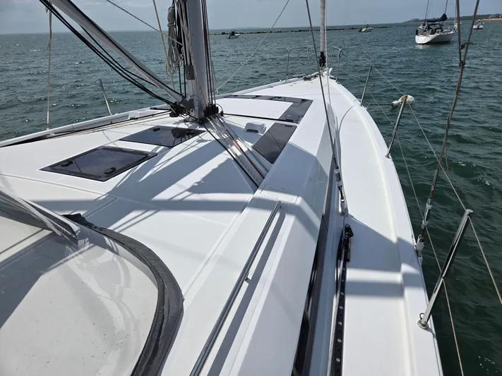 Off-piste Yacht Photos Pics 2019 Beneteau Oceanis 46.1 sailboat on calm waters, showcasing sleek deck design.