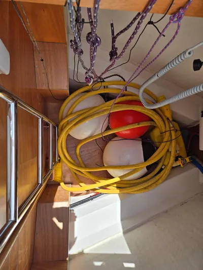 Off-piste Yacht Photos Pics Storage area on a 2019 Beneteau Oceanis 46.1 with ropes and buoys.