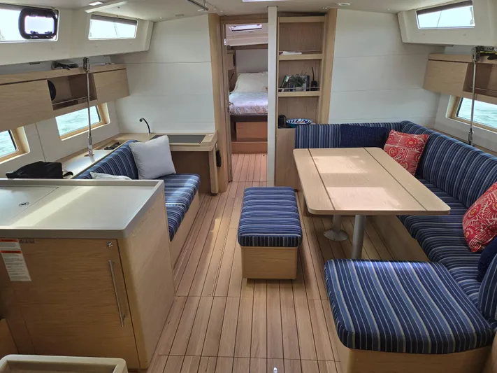 Off-piste Yacht Photos Pics Interior of 2019 Beneteau Oceanis 46.1 yacht with modern seating and dining area.