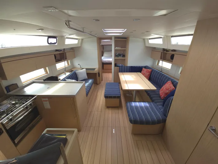 Off-piste Yacht Photos Pics Interior of 2019 Beneteau Oceanis 46.1 yacht with modern kitchen and cozy seating area.