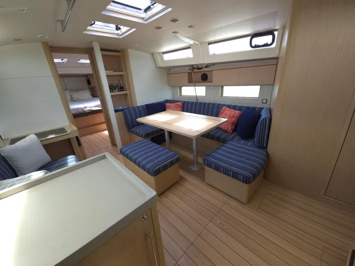Off-piste Yacht Photos Pics Interior of 2019 Beneteau Oceanis 46.1 yacht with cozy seating and modern design.