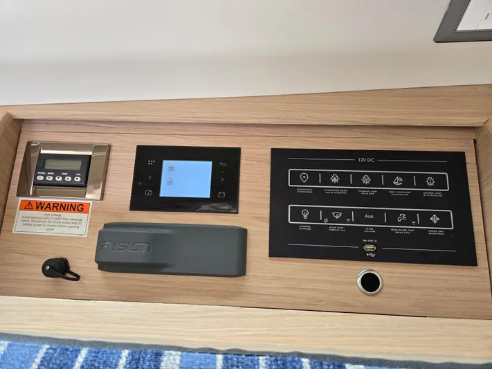 Off-piste Yacht Photos Pics Control panel of 2019 Beneteau Oceanis 46.1 yacht, featuring navigation and electronic systems.
