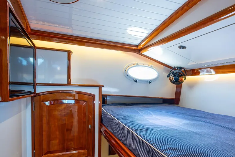 Oldielox 2 Yacht Photos Pics Luxurious cabin interior of 2019 Hinckley T55 MKII Motor Yacht with polished wood finish.