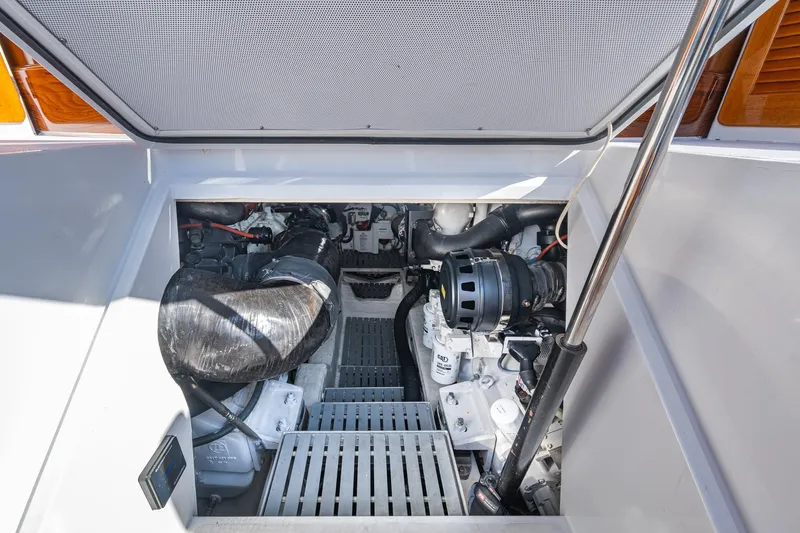 Oldielox 2 Yacht Photos Pics Engine compartment of 2019 Hinckley T55 MKII Motor Yacht, showcasing mechanical components.