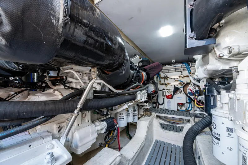 Oldielox 2 Yacht Photos Pics Engine room of 2019 Hinckley T55 MKII Motor Yacht, showcasing mechanical components.