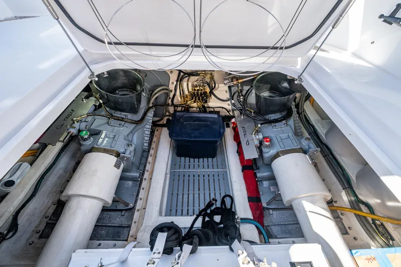 Oldielox 2 Yacht Photos Pics Engine room of 2019 Hinckley T55 MKII Motor Yacht, showcasing dual engines and mechanical components.