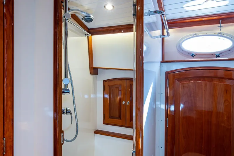 Oldielox 2 Yacht Photos Pics Luxurious wooden interior of 2019 Hinckley T55 MKII Motor Yacht bathroom with shower.