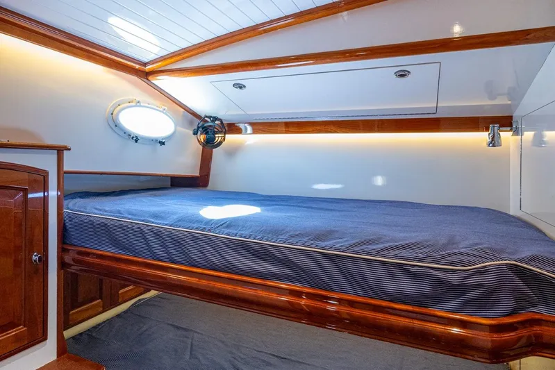 Oldielox 2 Yacht Photos Pics Luxurious cabin interior of 2019 Hinckley T55 MKII Motor Yacht with elegant wood finish.