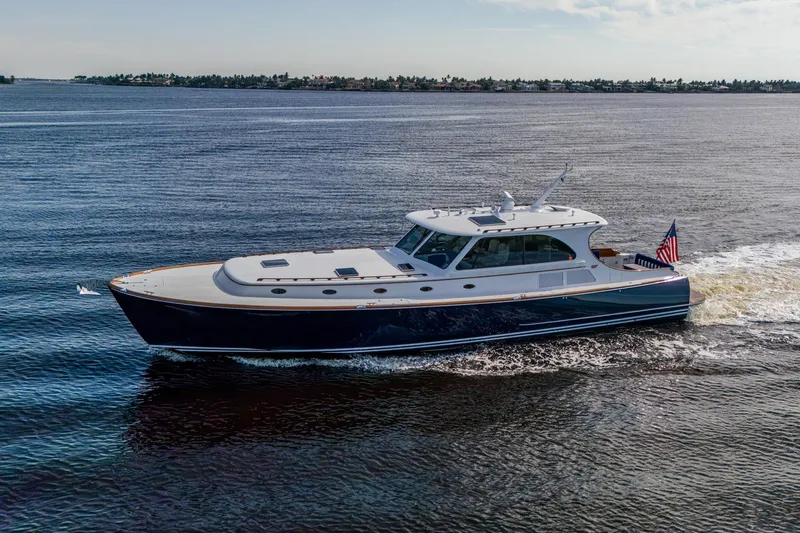 Oldielox 2 Yacht Photos Pics 2019 Hinckley T55 MKII Motor Yacht cruising on open water, displaying sleek design and elegance.
