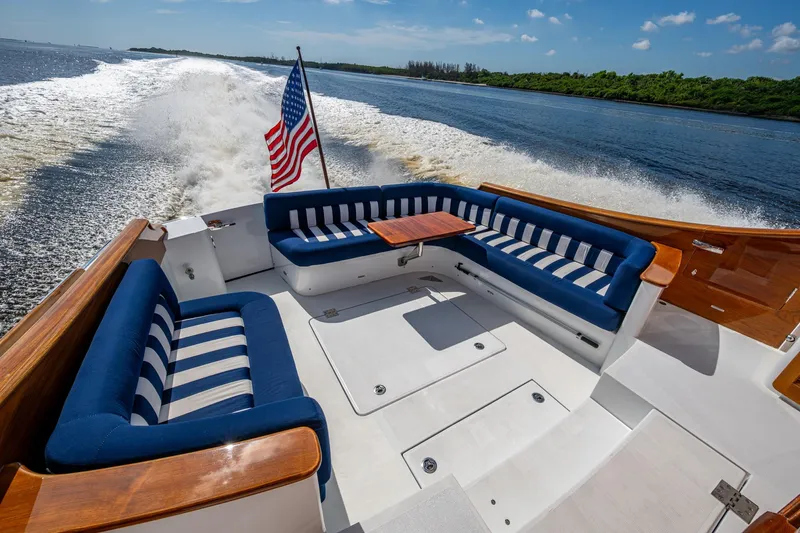 Oldielox 2 Yacht Photos Pics 2019 Hinckley T55 MKII Motor Yacht cruising with elegant seating and American flag.