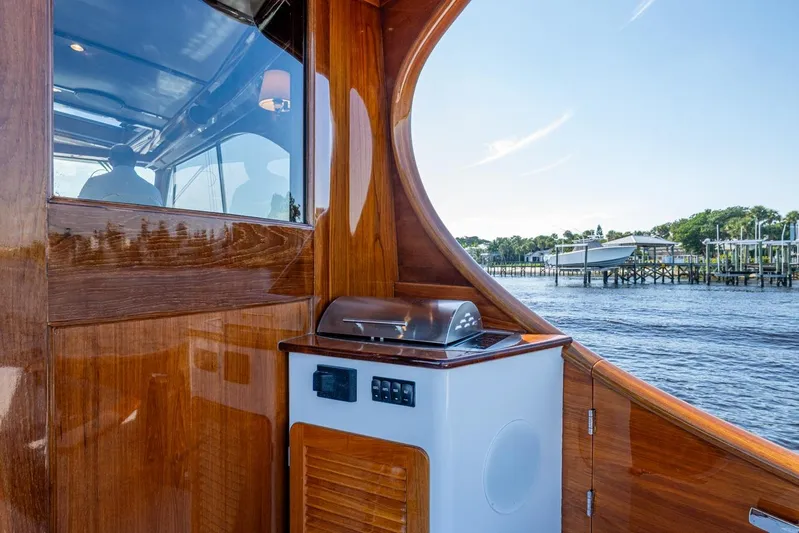 Oldielox 2 Yacht Photos Pics 2019 Hinckley T55 MKII Motor Yacht with sleek wooden interior and outdoor grill.
