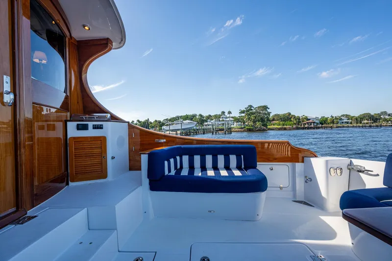 Oldielox 2 Yacht Photos Pics Luxurious 2019 Hinckley T55 MKII Motor Yacht deck with elegant seating and scenic water view.