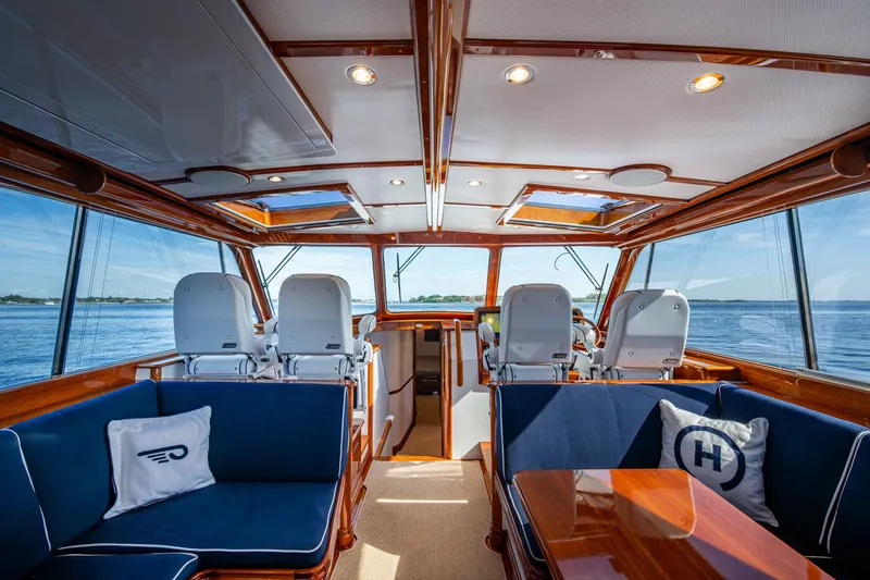 Oldielox 2 Yacht Photos Pics Luxurious interior of 2019 Hinckley T55 MKII Motor Yacht with plush seating and panoramic windows.