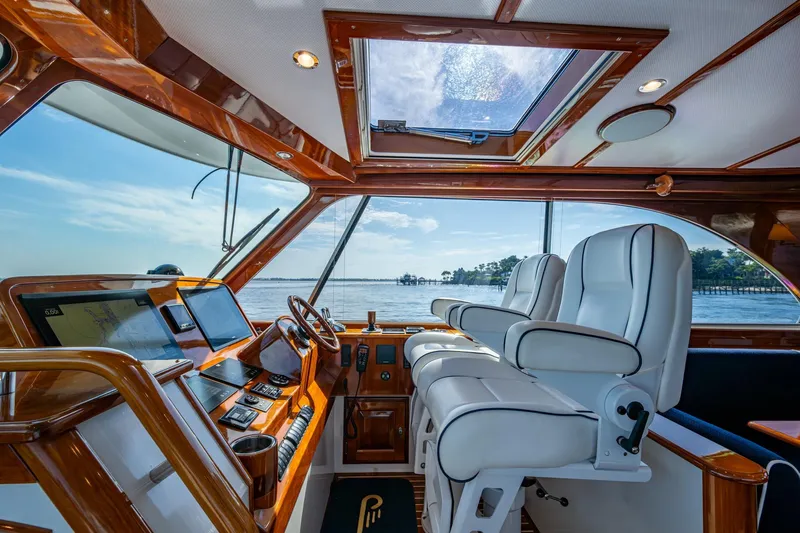 Oldielox 2 Yacht Photos Pics Interior of 2019 Hinckley T55 MKII Motor Yacht with luxurious helm and seating.