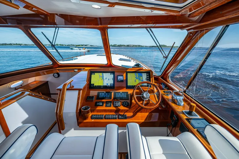 Oldielox 2 Yacht Photos Pics Luxurious 2019 Hinckley T55 MKII Motor Yacht cockpit with navigation screens and ocean view.