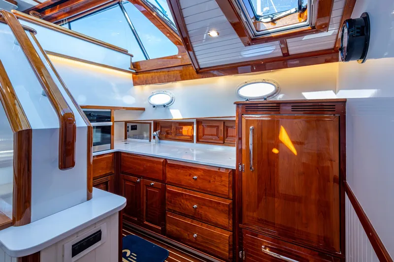 Oldielox 2 Yacht Photos Pics Luxurious interior of 2019 Hinckley T55 MKII Motor Yacht with elegant wood finishes.