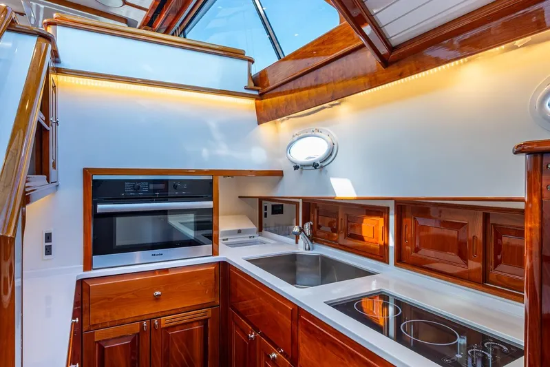 Oldielox 2 Yacht Photos Pics Luxurious kitchen interior of 2019 Hinckley T55 MKII Motor Yacht with modern appliances.