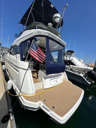  Yacht Photos Pics 2024 Bavaria R40 yacht docked, featuring sleek design and American flag.