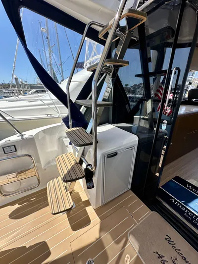  Yacht Photos Pics 2024 Bavaria R40 yacht with elegant wooden steps and modern design.