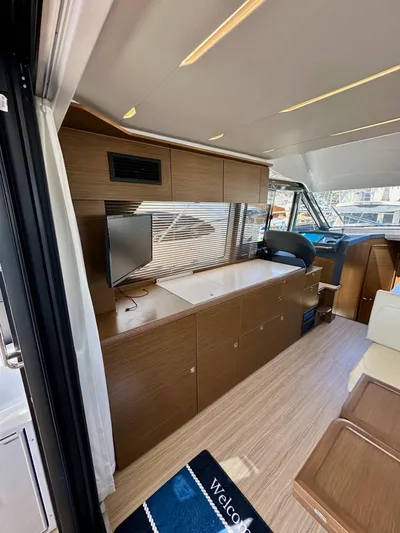  Yacht Photos Pics 2024 Bavaria R40 yacht interior with modern wood finish and sleek design.