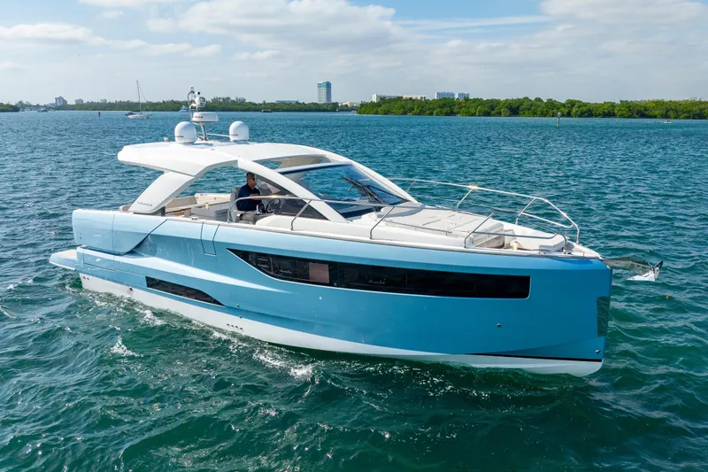  Yacht Photos Pics 2024 Jeanneau DB/43 OB yacht cruising on a sunny day in blue waters.