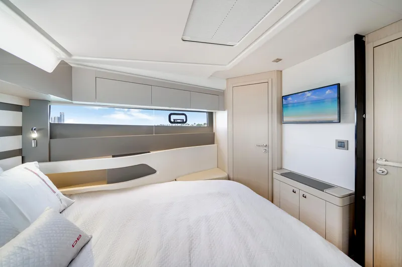  Yacht Photos Pics Luxurious cabin interior of 2024 Jeanneau DB/43 OB yacht with modern design and scenic window view.