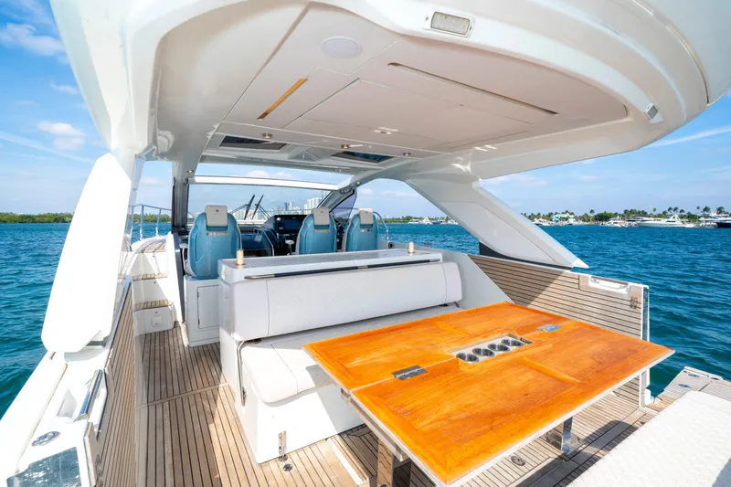  Yacht Photos Pics 2024 Jeanneau DB/43 OB yacht with elegant deck and seating, cruising on blue waters.