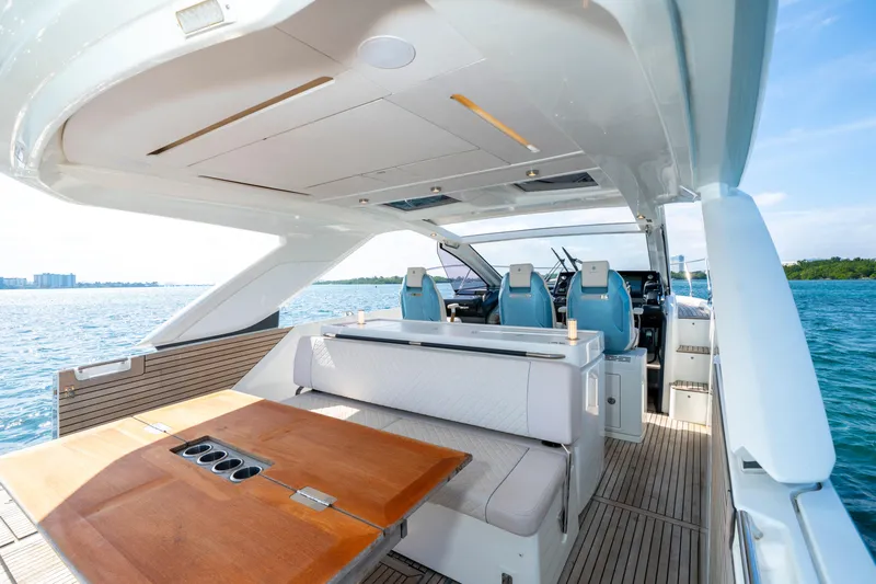  Yacht Photos Pics 2024 Jeanneau DB/43 OB yacht interior with seating and helm, overlooking the ocean.