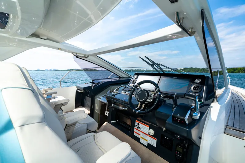  Yacht Photos Pics 2024 Jeanneau DB/43 OB yacht cockpit with modern controls and panoramic water view.