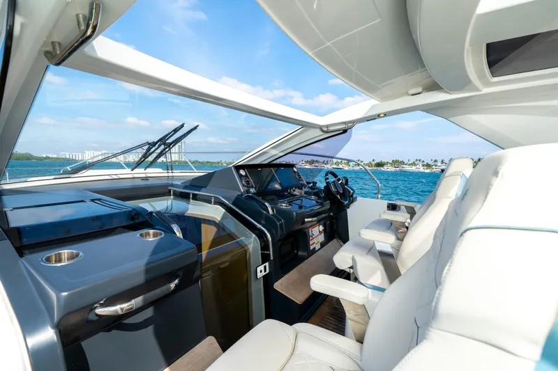  Yacht Photos Pics 2024 Jeanneau DB/43 OB yacht cockpit with luxurious seating and ocean view.