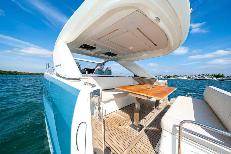  Yacht Photos Pics 2024 Jeanneau DB/43 OB yacht with open deck and seating, cruising on blue waters.