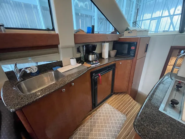 Seaduced Yacht Photos Pics 2006 Meridian 341 Sedan yacht kitchen with sink, coffee maker, and microwave.