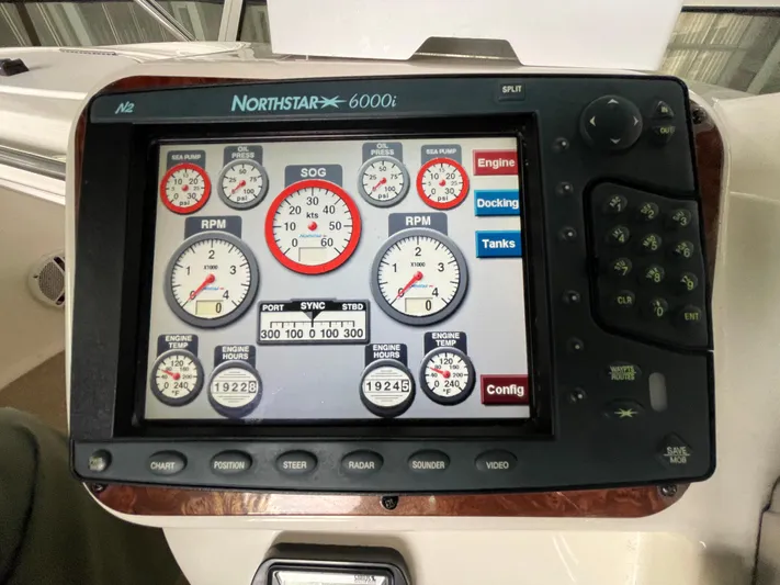 Seaduced Yacht Photos Pics Navigation display on a 2006 Meridian 341 Sedan boat showing engine and system gauges.