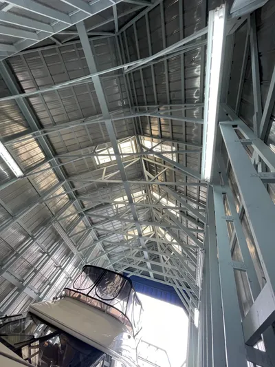 Seaduced Yacht Photos Pics 2006 Meridian 341 Sedan yacht in a metal boat shed.