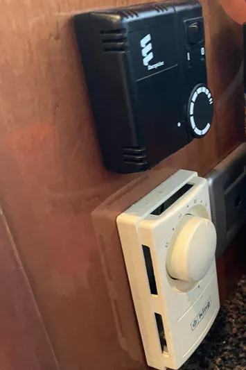 Seaduced Yacht Photos Pics Control panel and thermostat in a 2006 Meridian 341 Sedan yacht interior.