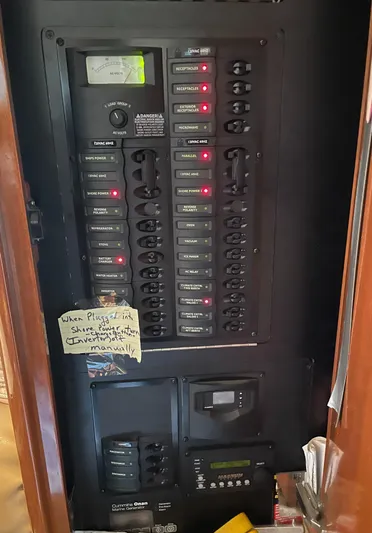 Seaduced Yacht Photos Pics Electrical panel inside a 2006 Meridian 341 Sedan boat, featuring labeled switches and controls.