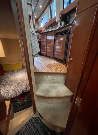 Seaduced Yacht Photos Pics Interior view of a 2006 Meridian 341 Sedan yacht, featuring a compact kitchen area.