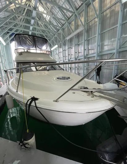 Seaduced Yacht Photos Pics 2006 Meridian 341 Sedan yacht docked in a covered marina.