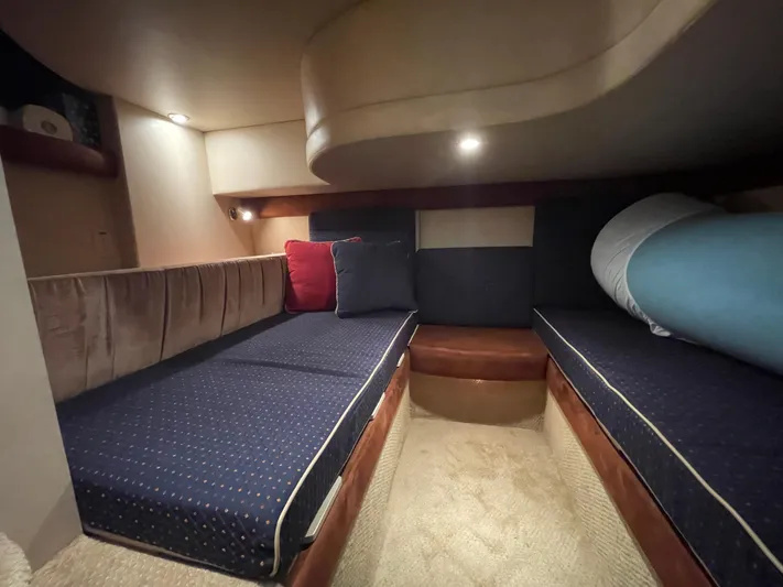 Seaduced Yacht Photos Pics 2006 Meridian 341 Sedan interior cabin with blue cushioned seating and ambient lighting.
