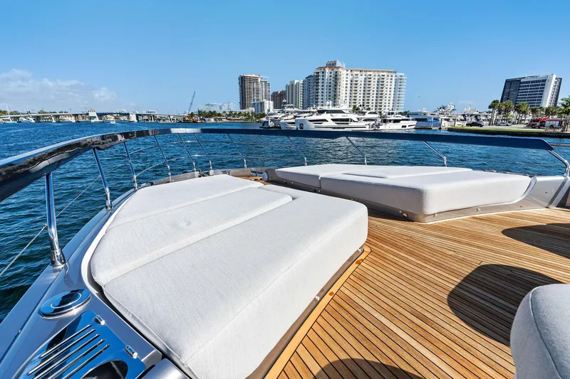 Yesenia Yacht Photos Pics 2024 Azimut S8 yacht deck with city skyline and marina view.