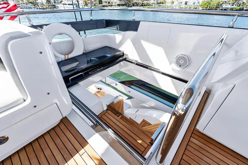 Yesenia Yacht Photos Pics 2024 Azimut S8 yacht deck with wooden flooring and stairway access.