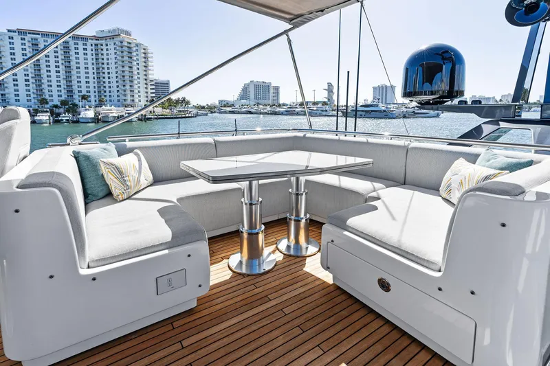 Yesenia Yacht Photos Pics Luxurious seating area on 2024 Azimut S8 yacht with waterfront view.
