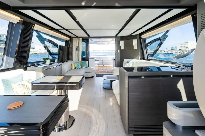 Yesenia Yacht Photos Pics Luxurious interior of 2024 Azimut S8 yacht with modern furnishings and panoramic windows.