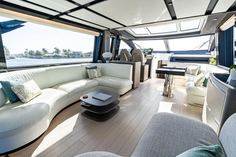 Yesenia Yacht Photos Pics Luxurious interior of 2024 Azimut S8 yacht with modern seating and panoramic windows.